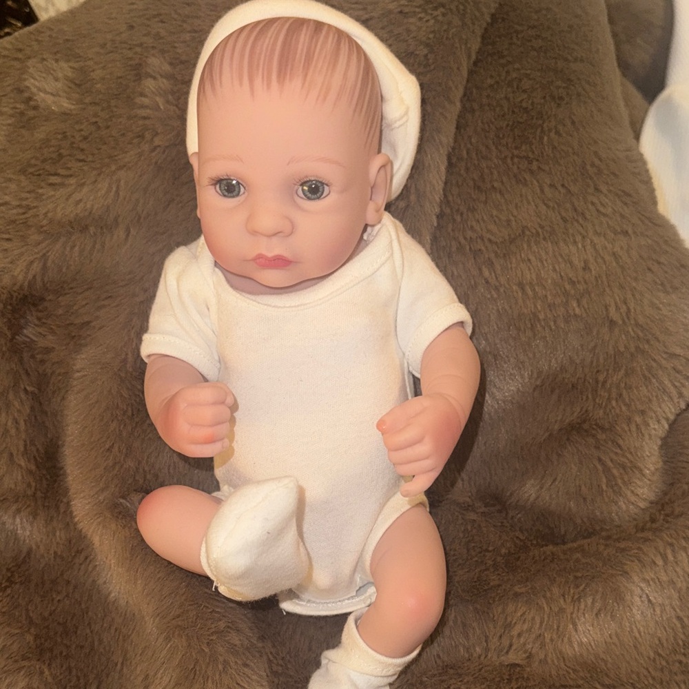 Realistic Baby Doll with White Outfit